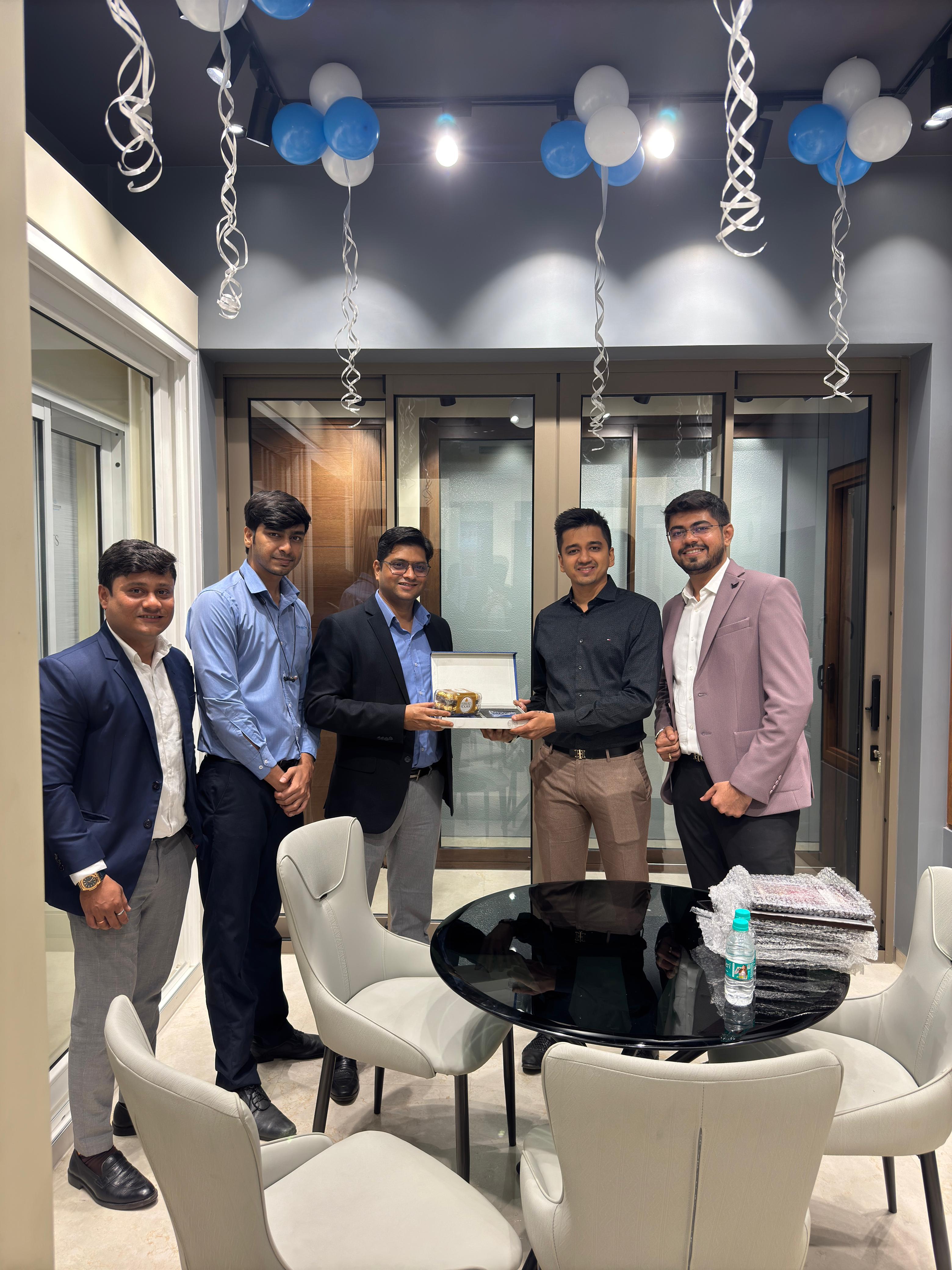 The Window Project team inside the Fenesta showroom with window and door displays
